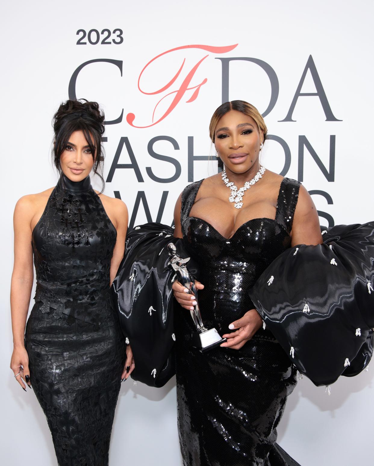 Serena Williams, fashion icon award winner, right, and Kim Kardashian, attend the 2023 CFDA Fashion Awards at American Museum of Natural History on Monday in New York City.