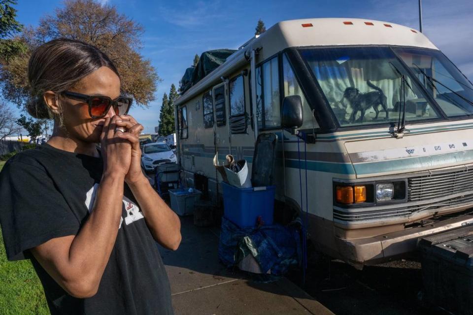 Days before Christmas, Nicole Casper worries about her Winnebago being towed away by the city as her dog looks out the window on Opportunity Street in Sacramento. “It’s stressful not knowing if they are coming or not going to come,” she said. The motor home was towed on Jan. 23 and she said she only had 15 minutes to remove her things.