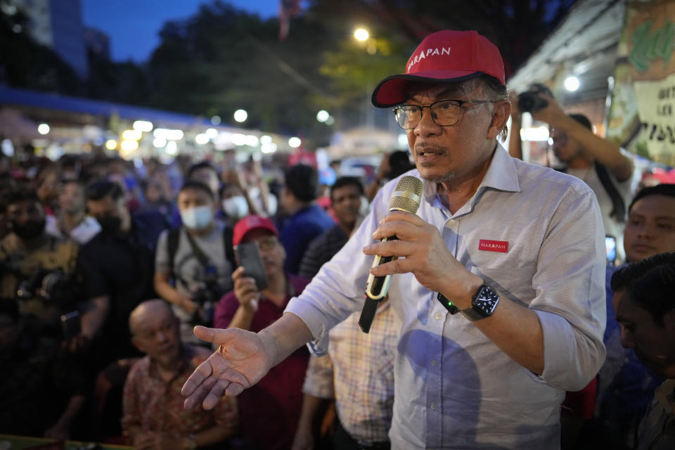 FILE - Malaysian opposition leader Anwar Ibrahim speaks to supporters during an election campaign in Kuala Lumpur, Malaysia, Nov. 16, 2022. Marking his first anniversary of coming to power, Malaysian Prime Minister Anwar admitted he was still struggling to win over ethnic Malay votes and acknowledged frustration over the slow pace of reforms. But he defended his unity government, saying it is now politically stable and able to fully focus on bolstering the economy and improving the people's welfare. (AP Photo/Vincent Thian, File)