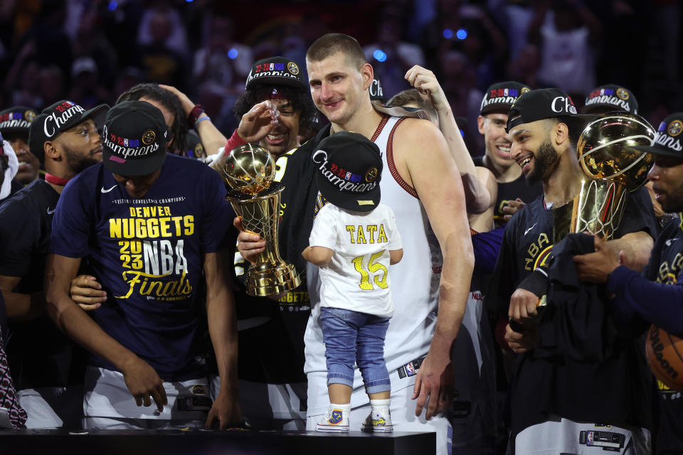 DENVER, COLORADO - JUNE 12: Nikola Jokic #15 of the Denver Nuggets celebrates with the Bill Russell NBA Finals Most Valuable Player Award after a 94-89 victory against the Miami Heat in Game Five of the 2023 NBA Finals to win the NBA Championship at Ball Arena on June 12, 2023 in Denver, Colorado. NOTE TO USER: User expressly acknowledges and agrees that, by downloading and or using this photograph, User is consenting to the terms and conditions of the Getty Images License Agreement. (Photo by Matthew Stockman/Getty Images)