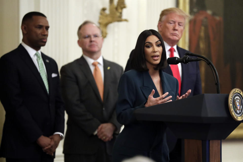 President Donald Trump listens to Kim Kardashian West, who is among the celebrities who have advocated for criminal justice reform, speak during an event on second chance hiring in the East Room of the White House, Thursday, June 13, 2019, in Washington.