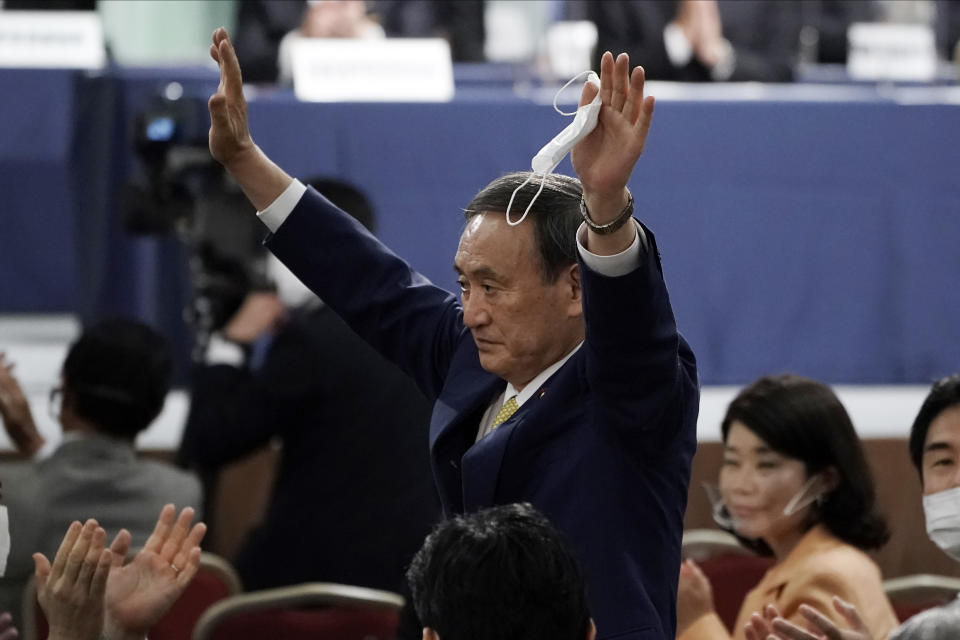 Japanese Chief Cabinet Secretary Yoshihide Suga acknowledges as he is elected as new head of Japan's ruling party at the Liberal Democratic Party's (LDP) leadership election Monday, Sept. 14, 2020, in Tokyo. The ruling LDP chooses its new leader in an internal vote to pick a successor to Prime Minister Shinzo Abe, who announced his intention to resign last month due to illness. (AP Photo/Eugene Hoshiko, Pool)