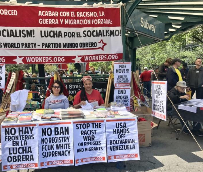 Organizers with the World Workers Party, a socialist organization founded in 1959, sit in New York City’s Union Square during a worker’s strike on May 1. (Photo: Caitlin Dickson/Yahoo News)