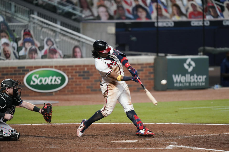 Atlanta Braves' Ronald Acuna Jr. hits an RBI double during the sixth inning of the team's baseball game against the Miami Marlins on Wednesday, Sept. 9, 2020, in Atlanta. (AP Photo/Brynn Anderson)