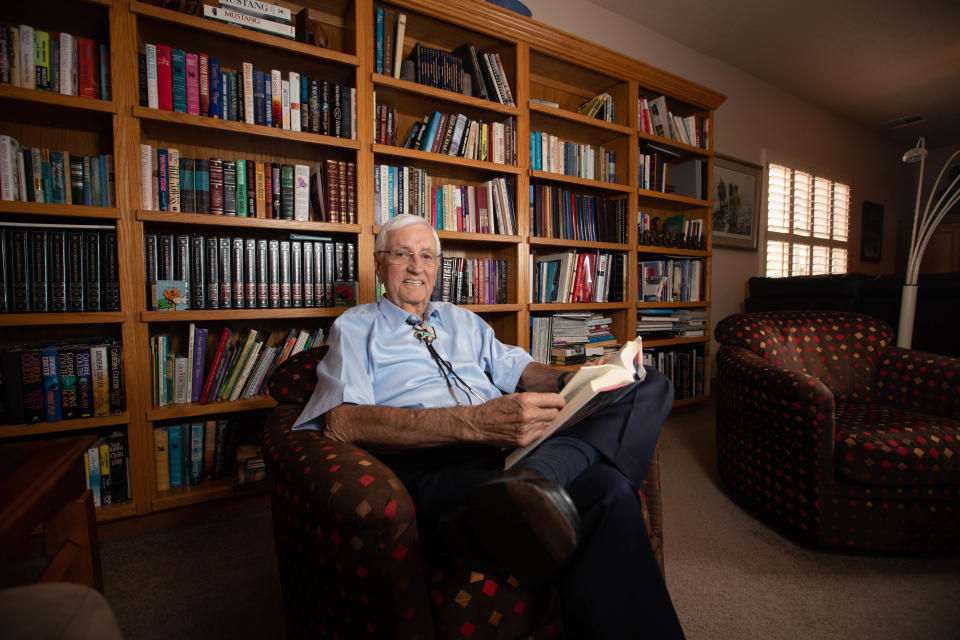 Former New Mexico Governor and former New Mexico State University Chancellor and President Garrey Carruthers is pictured in his home library in Las Cruces on Thursday, Dec. 16, 2021.