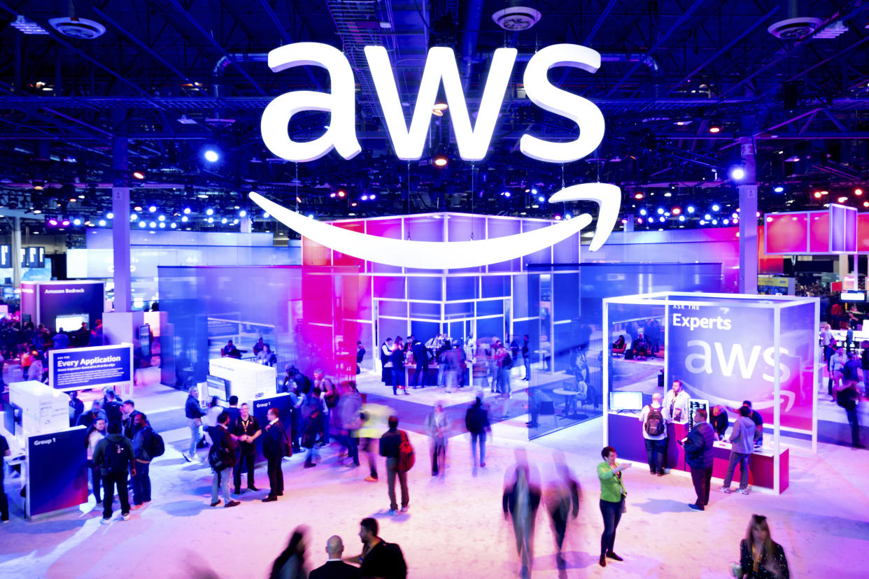 IMAGE DISTRIBUTED FOR AWS - Attendees walk through an expo hall at AWS re:Invent 2023, a conference hosted by Amazon Web Services, on Wednesday, Nov. 29, 2023, in Las Vegas. (Noah Berger/Amazon Web Services via AP Images)