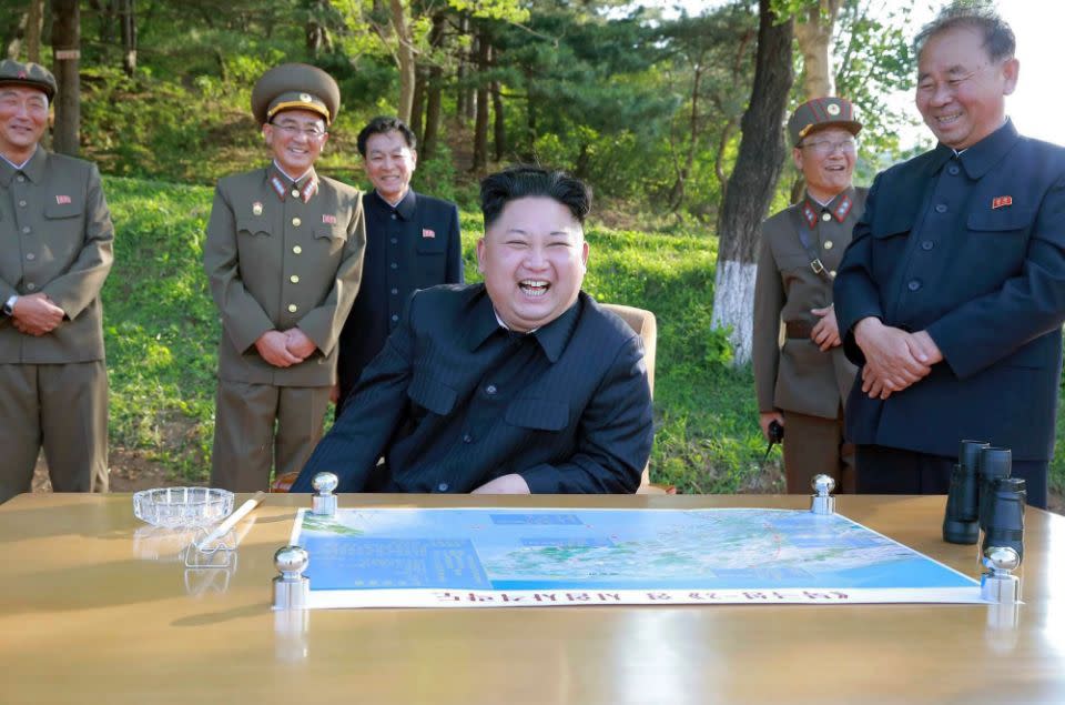 Kim Jong-un and officials at a test missile launch on May 22. Photo: AAP