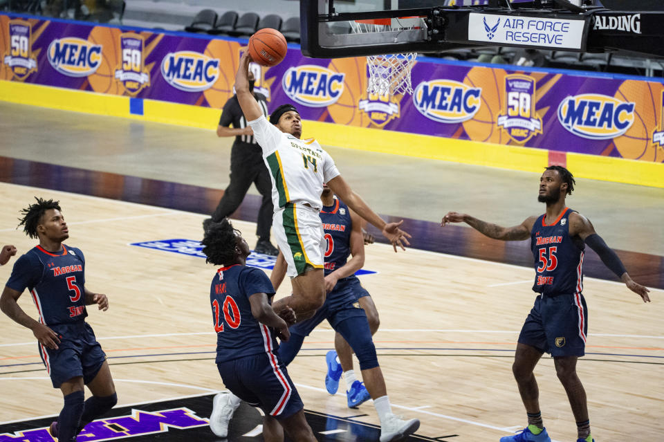 Norfolk State's Devante Carter (14) goes up for a dunk against Morgan State during the first half of of an NCAA college basketball game in the championship of the Mid-Eastern Athletic Conference tournament at the Scope Arena on Saturday, March 13, 2021, in Norfolk, Va. (AP Photo/Mike Caudill)