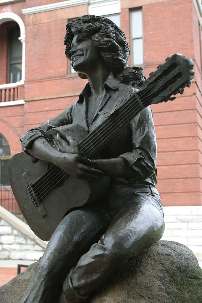 A Dolly Parton statue sits on the lawn of the Sevier County Courthouse in Sevierville, Tennessee. (Photo: Jeffrey Greenberg/Universal Images Group via Getty Images)
