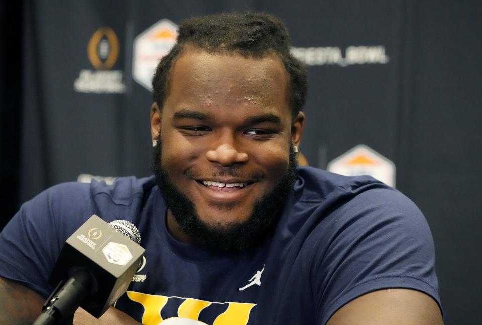 Michigan Wolverines defensive lineman Mazi Smith (58) speaks during Vrbo Fiesta Bowl media day at Camelback Inn in Scottsdale on Dec. 29, 2022.