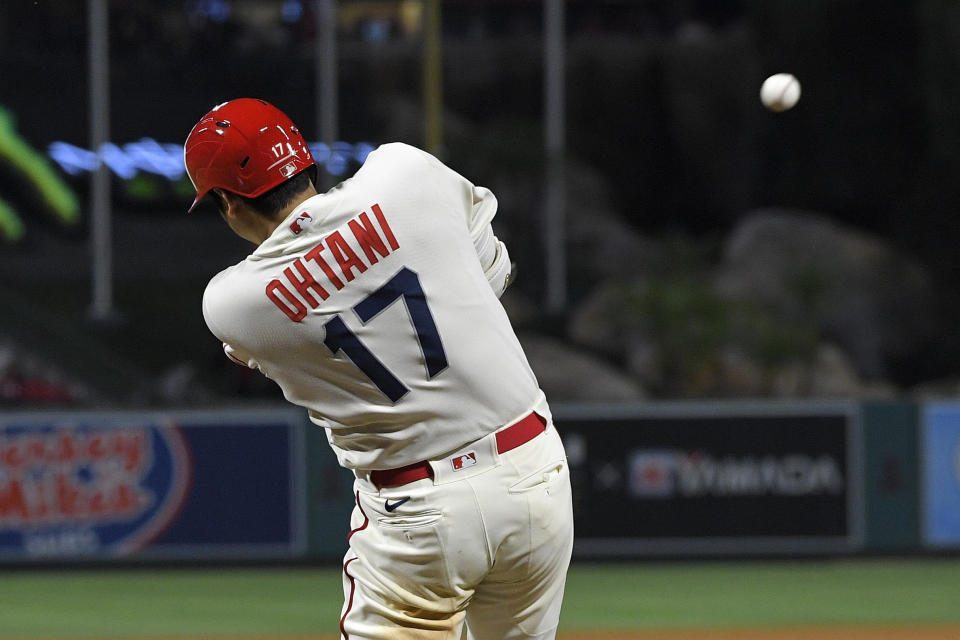 Los Angeles Angels' Shohei Ohtani hits a two-run home run during the fifth inning of a baseball game against the New York Mets Saturday, June 11, 2022, in Anaheim, Calif. (AP Photo/Mark J. Terrill)