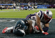 <p>Philadelphia Eagles wide receiver Alshon Jeffery (17), falls to the end zone as he makes a touchdown catch against New England Patriots cornerback Eric Rowe (25), during the first half of the NFL Super Bowl 52 football game, Sunday, Feb. 4, 2018, in Minneapolis. (AP Photo/Frank Franklin II) </p>