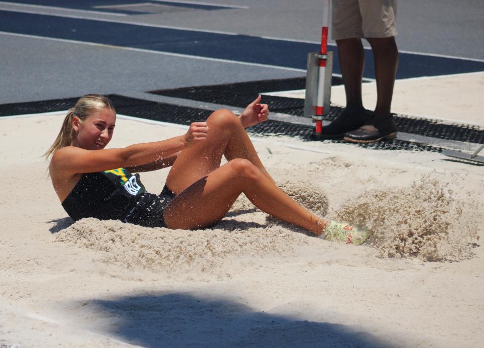 Tristen Evatt of Yulee lands in the girls long jump pit during the FHSAA Class 2A high school track and field meet in Jacksonville on May 16, 2024. She went on to win the event. [Clayton Freeman/Florida Times-Union]