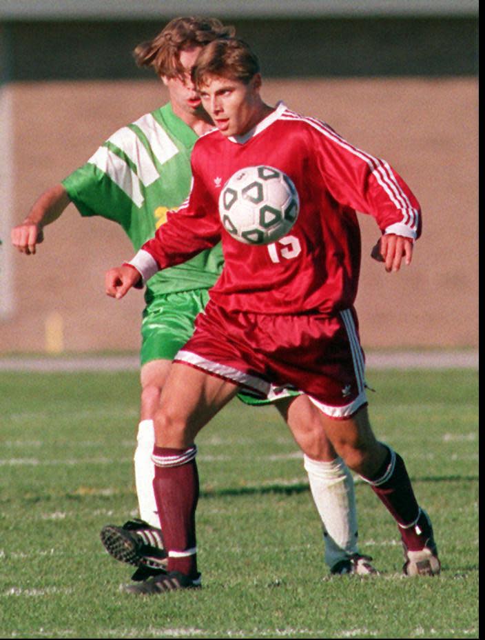 Greece Arcadia's Dema Kovalenko, front, is shadowed by Greece Olympia's John Saller during a game Thursday, September 28, 1995, at Greece Olympia High School.