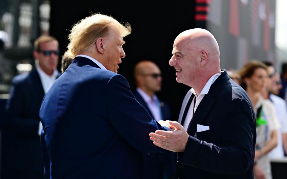 Donald Trump talks to Gianni Infantino