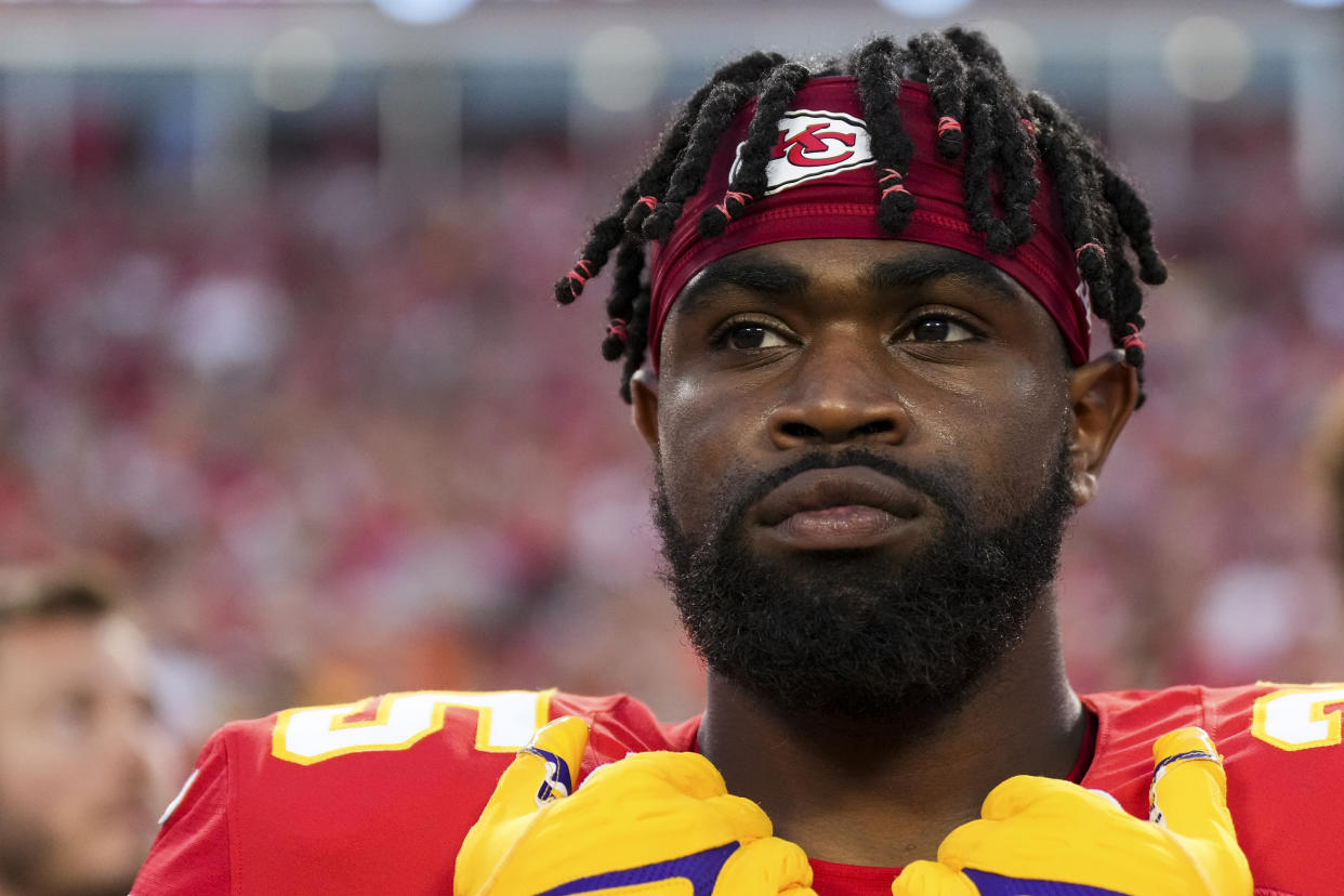 KANSAS CITY, MO - SEPTEMBER 15: Clyde Edwards-Helaire #25 of the Kansas City Chiefs stands during the national anthem against the Los Angeles Chargers at GEHA Field at Arrowhead Stadium on September 15, 2022 in Kansas City, Missouri. (Photo by Cooper Neill/Getty Images)