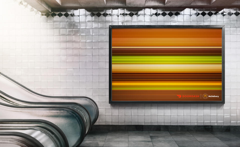 A McDonald's billboard ad featuring horizontal lines using the colours of a Big Mac to create the impression of it moving at speed