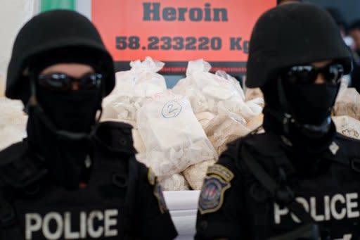 Thai police stand guard over seized drugs in Ayutthaya province in June 2012. The UN's drugs and crime office launched a new media awareness campaign on Monday to highlight the threat posed by the multi-billion dollar operations run by organised crime groups worldwide