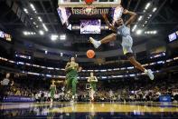 Marquette's Chase Ross dunks during the first half of an NCAA college basketball game against Baylor Tuesday, Nov. 29, 2022, in Milwaukee. (AP Photo/Morry Gash)