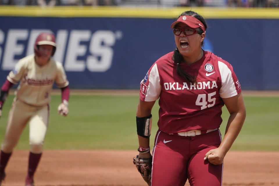 Oklahoma's Giselle Juarez (45) reacts after striking out Florida State's Cassidy Davis to end the first half of the first inning of the final game of the NCAA Women's College World Series softball championship series Thursday, June 10, 2021, in Oklahoma City. (AP Photo/Sue Ogrocki)