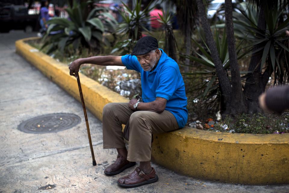 In this Feb. 19, 2014 photo, an old man rests alone in a square downtown in Caracas, Venezuela. There is plenty of discontent among the lower classes but the students have failed to capitalize on it. But Venezuela’s poor are, on the whole, more worried about losing the pensions, subsidisies, education and health services gained under Chavez if the opposition were to come to power. (AP Photo/Rodrigo Abd)