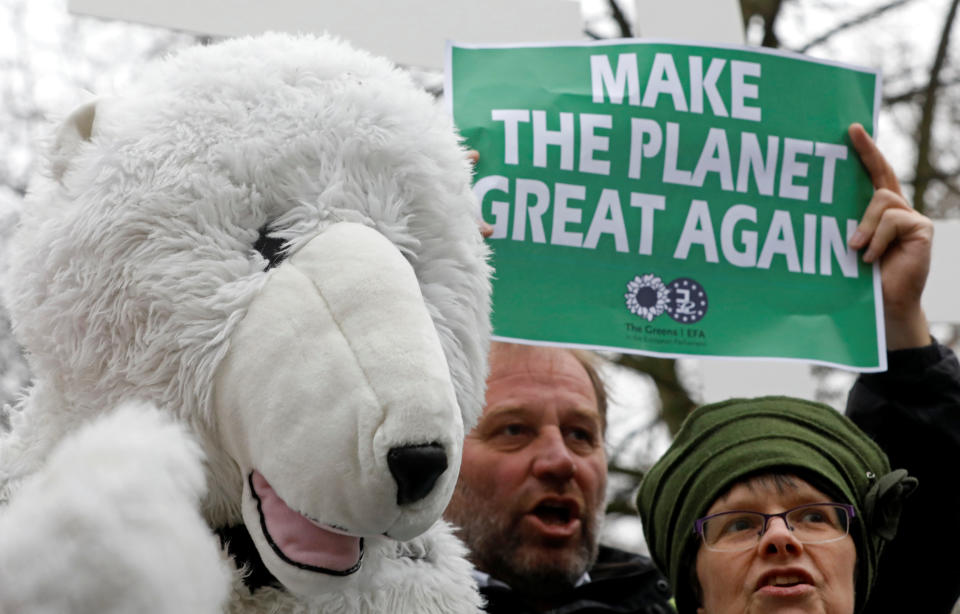 Environmental activists take part in a protest while Myron Ebell, who leads U.S. President Donald Trump's Environmental Protection Agency's transition team, arrives at the Solvay library in Brussels, Belgium to address a meeting, February 1, 2017. REUTERS/Yves Herman