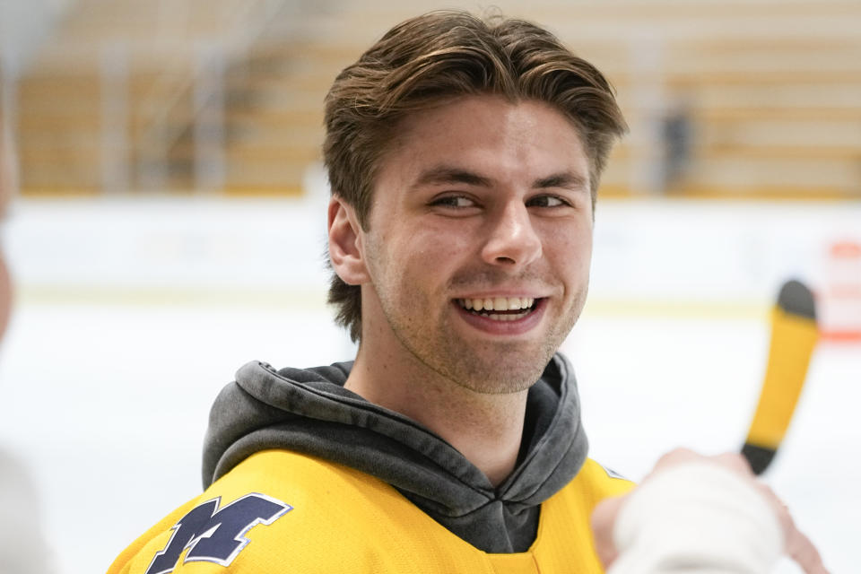 NHL draft prospect Adam Fantilli smiles during a youth hockey clinic, Tuesday, June 27, 2023, in Nashville, Tenn. (AP Photo/George Walker IV)
