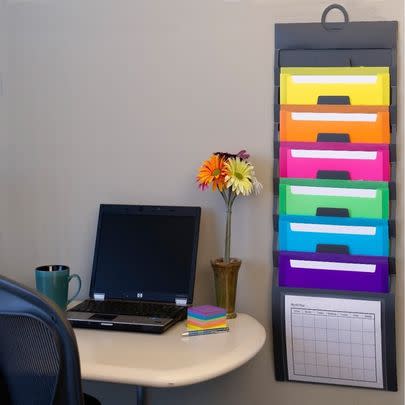 A hanging set of rainbow folders to give you some filing cabinet space and add a pop of color to your cubicle