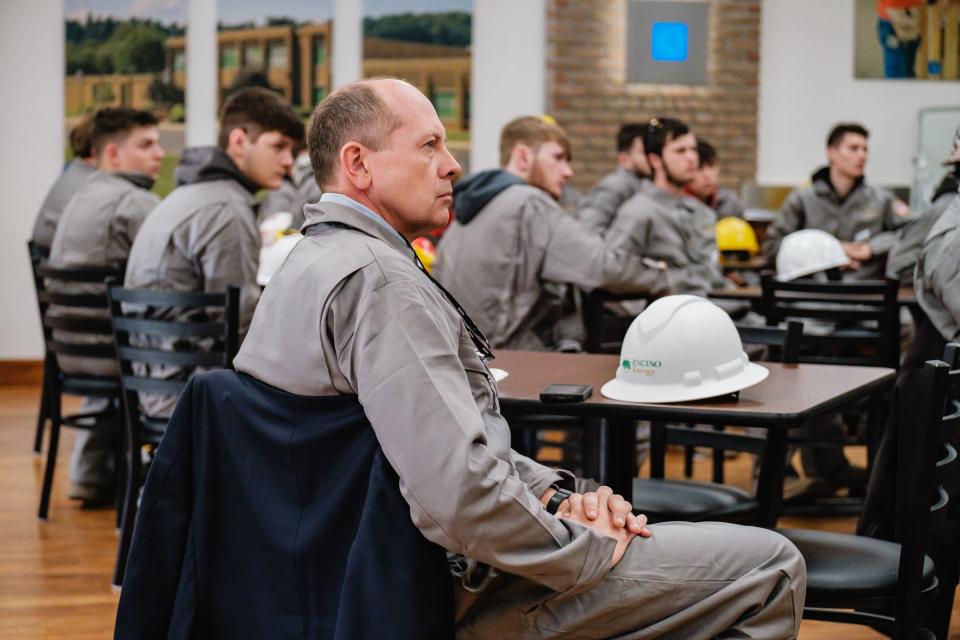 Ohio State Sen. Jay Hottinger listens to an introductory briefing before embarking on a tour of the Encino Energy Leeper rig and well pad on Thursday in Sherrodsville.