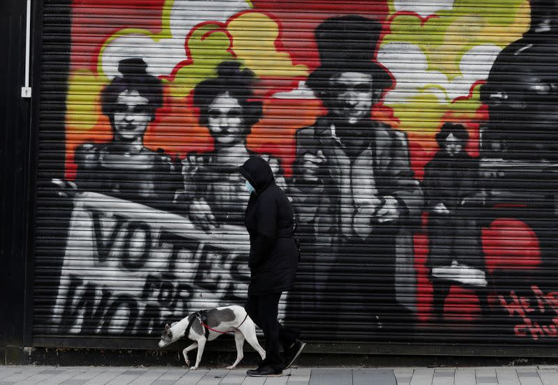 A person walks their dog ahead of tomorrow's local elections, in Hartlepool