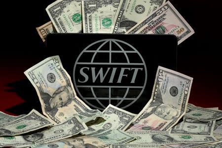 The SWIFT logo is pictured in this photo illustration taken April 26, 2016. REUTERS/Carlo Allegri/Illustration/File Photo