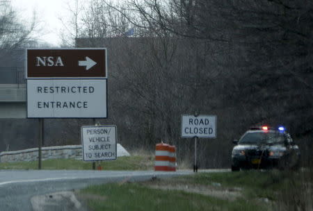 A police car blocks one of many entrance points into the National Security Administration facility in Fort Meade, Maryland March 30, 2015. REUTERS/Gary Cameron