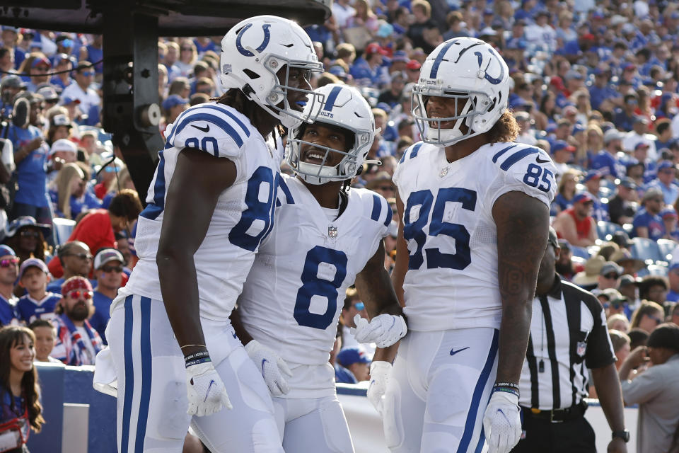 Indianapolis Colts tight end Jelani Woods (80) celebrates his touchdown reception against the Buffalo Bills with wide receiver D.J. Montgomery (8) and tight end Andrew Ogletree (85) during the second half of a preseason NFL football game Saturday, Aug. 13, 2022, in Orchard Park, N.Y. (AP Photo/Jeffrey T. Barnes)