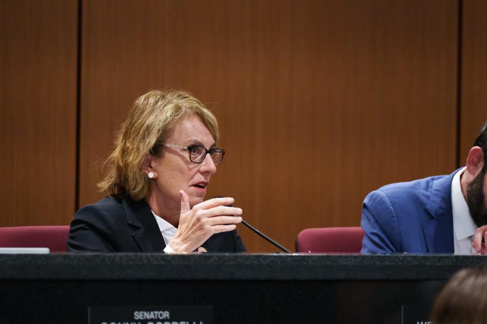 Sen. Wendy Rogers attends a joint House and Senate election committee hearing at the state Capitol in Phoenix on Feb. 23, 2023.