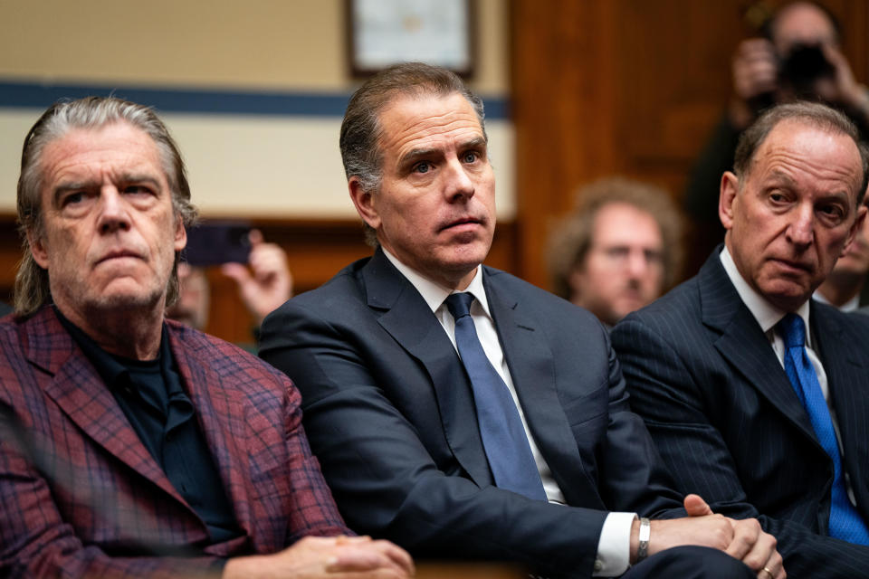Hunter Biden, flanked by Kevin Morris, left, and Abbe Lowell, right, attends a House Oversight Committee meeting on Jan. 10, 2024, in Washington, D.C. / Credit: Kent Nishimura / Getty Images