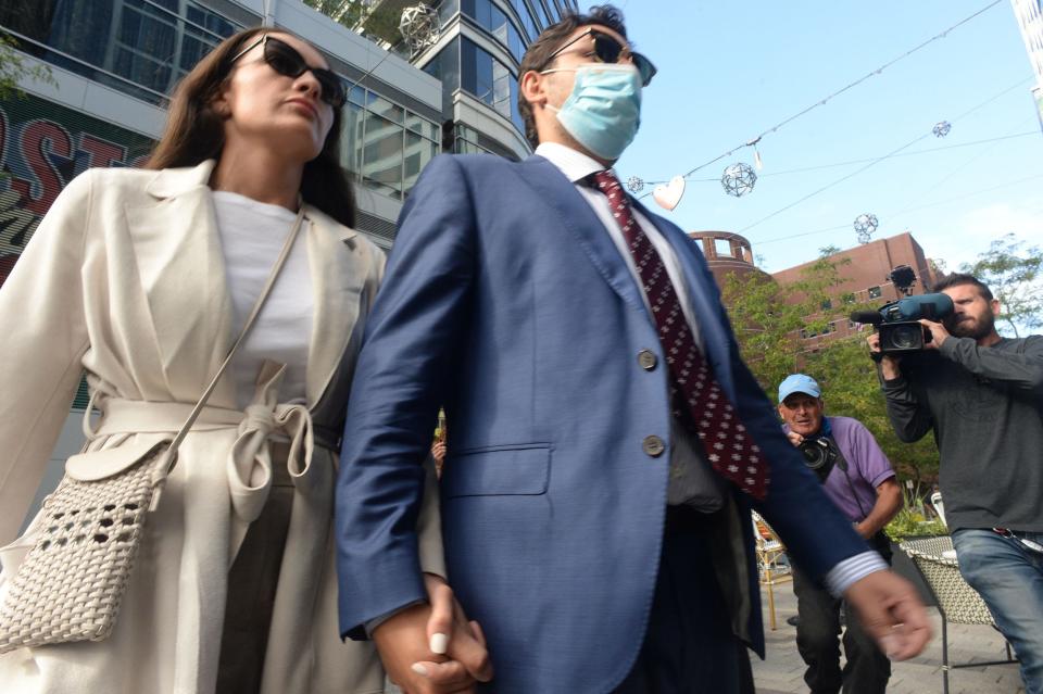 Former Fall River Mayor Jasiel Correia II,  exits John Joseph Moakley Federal Courthouse with his wife Jen Fernandes on Tuesday, Sept. 21, 2021. 