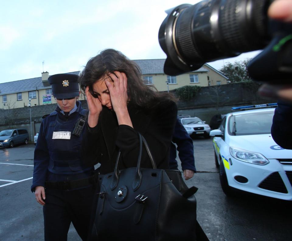 Jenny Lauren, centre, Niece of fashion designer Ralph Lauren, arrives at Killaloe District Court, in Killaloe, Ireland, Tuesday, Jan. 7, 2014. The niece of fashion designer Ralph Lauren has appeared in an Irish court on charges of being drunk and disorderly on a New York-bound plane. Jewelry designer Jenny Lauren was arrested after a Delta flight from Barcelona made an unscheduled stop at Shannon Airport on Monday. (AP Photo/PA, Niall Carson) UNITED KINGDOM OUT