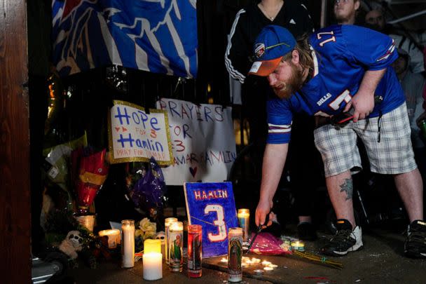 PHOTO: Buffalo Bills fan Dustin Peters attends a candlelight vigil for Bills safety Damar Hamlin at University of Cincinnati Medical Center on Jan. 3, 2023, in Ohio. (Jeff Dean/Getty Images)