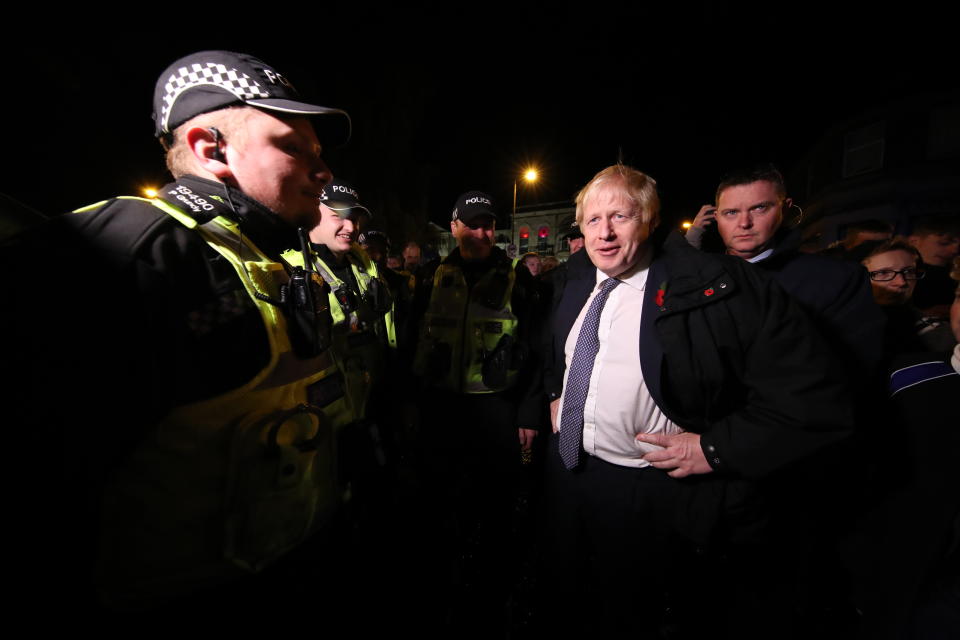 Britain's Prime Minister Boris Johnson visit a flood-effected area in Matlock, northern England, on November 8, 2019. - Over a month's worth of rain fell on parts of England Thursday, with some people forced to evacuate their homes, and others left stranded in a Sheffield shopping centre. (Photo by Danny Lawson / POOL / AFP) (Photo by DANNY LAWSON/POOL/AFP via Getty Images)