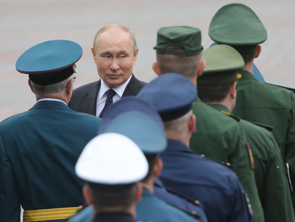 Russian President Vladimir Putin greets officers during the wreath laying ceremony at the Tomb of the Unknown Soldier near the Kremlin, on June 22, 2022 in Moscow, Russia. Russians mark the Day of Sorrow and the Remembrance of Victims of World War II at the 81th anniversary of the beginning of German Nazi's invasion into Soviet Union.