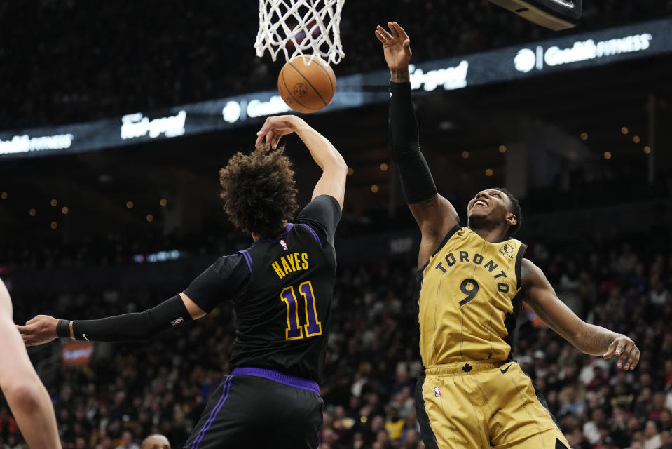 Los Angeles Lakers centre Jaxson Hayes (11) and Toronto Raptors guard RJ Barrett (9) vie for a rebound during the second half of an NBA basketball game Tuesday, April 2, 2024, in Toronto. (Frank Gunn/The Canadian Press via AP)