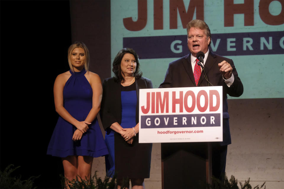 Democratic Attorney General Jim Hood, a gubernatorial candidate, talks to gathered supporters after winning the party primary as his wife, Debbie, and daughter Annabelle look on, Tuesday, Aug. 6, 2019, at Duling Hall in Jackson, Miss. (AP Photo/Charles A. Smith)