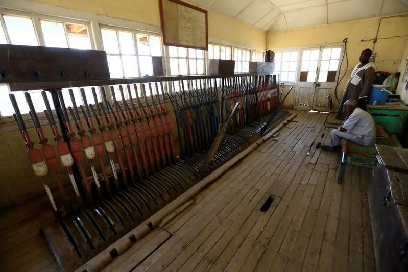 Workers are seen inside the Atbara railway station in Nile State,