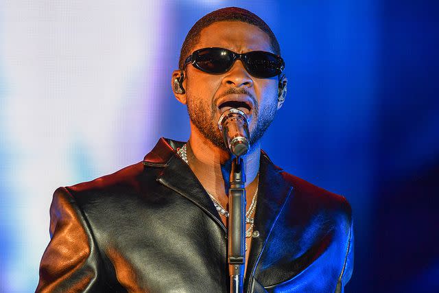 <p>Aaron J. Thornton/WireImage</p> Usher performs in Las Vegas in May 2023