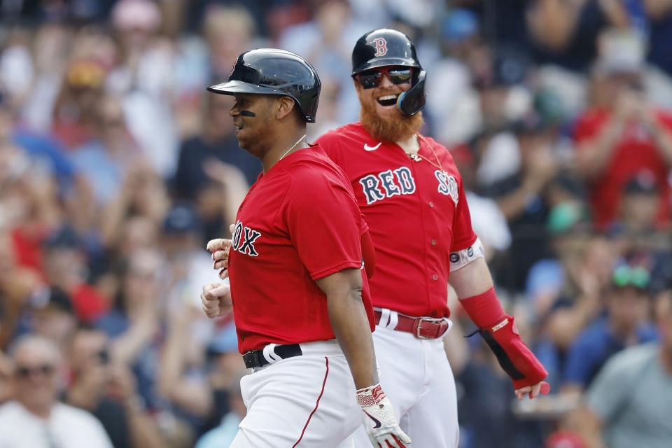 Boston Red Sox's Rafael Devers, left, celebrates after his three-run home run that also drove in Justin Turner, right, during the fourth inning of a baseball game against the Toronto Blue Jays, Saturday, Aug. 5, 2023, in Boston. (AP Photo/Michael Dwyer)