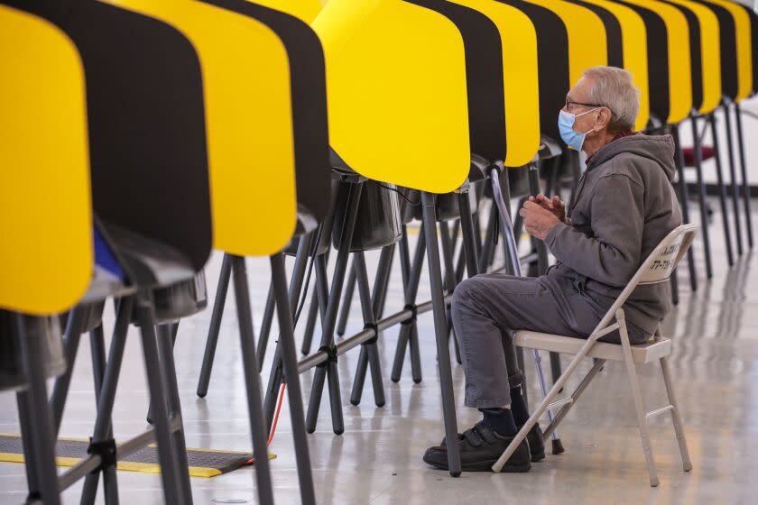 Norwalk, CA - November 03: Myron Chesler works on a ballot marking device while voting at Los Angeles County Registrar-Recorder/County Clerk on Thursday, Nov. 3, 2022 in Norwalk, CA. (Irfan Khan / Los Angeles Times)