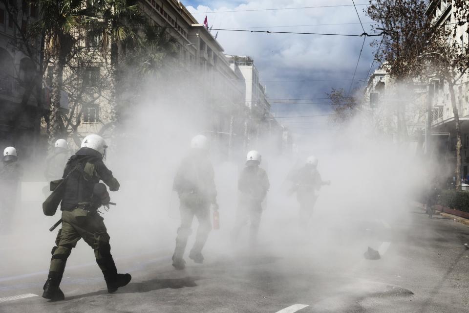 Riot police operate against demonstrators during clashes in Athens, Greece, Sunday, March 5, 2023. Thousands protesters, take part in rallies around the country for fifth day, protesting the conditions that led the deaths of dozens of people late Tuesday, in Greece's worst recorded rail accident. (AP Photo/Yorgos Karahalis)