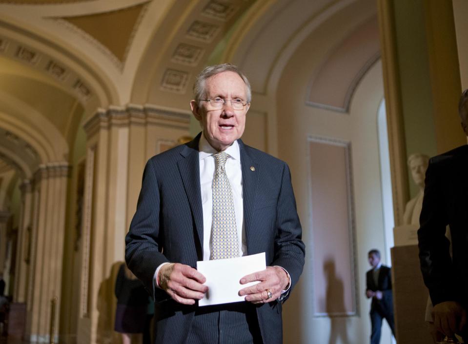 Senate Majority Leader Harry Reid of Nev. arrives to speak with reporters on Capitol Hill in Washington, Tuesday, July 23, 2013, after a Senate Democratic caucus. (AP Photo/J. Scott Applewhite)