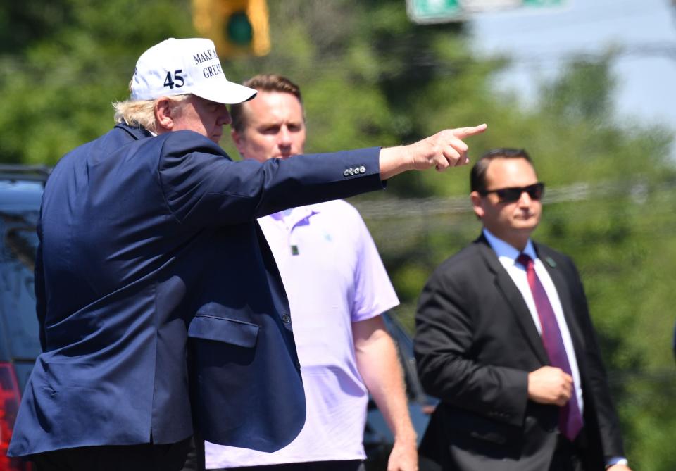 President Donald Trump greets supporters after leaving Trump National Golf Club in Bedminster, New Jersey, on July 26. (Photo: NICHOLAS KAMM via Getty Images)