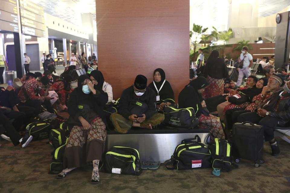 <span class="caption">Muslim families were stranded at airports after Saudi Arabia halted the entry of pilgrims to holy sites.</span> <span class="attribution"><a class="link " href="http://www.apimages.com/metadata/Index/Virus-Outbreak-Indonesia/8678a393d3964bffaa8b4707aa91a092/9/0" rel="nofollow noopener" target="_blank" data-ylk="slk:AP Photo/Tatan Syuflana;elm:context_link;itc:0;sec:content-canvas">AP Photo/Tatan Syuflana</a></span>